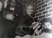 Sabrina signs autographs