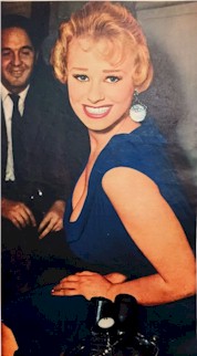 Sabrina big smile in a blue dress