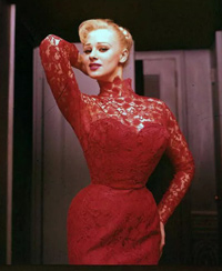 Sabrina in a doorway, striking a pose