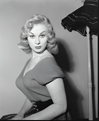 Sabrina (Norma Sykes) ignores a lamp