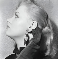 Sabrina (Norma Sykes) in gloves with an earring