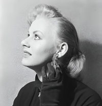 Sabrina (Norma Sykes) in gloves with an earring